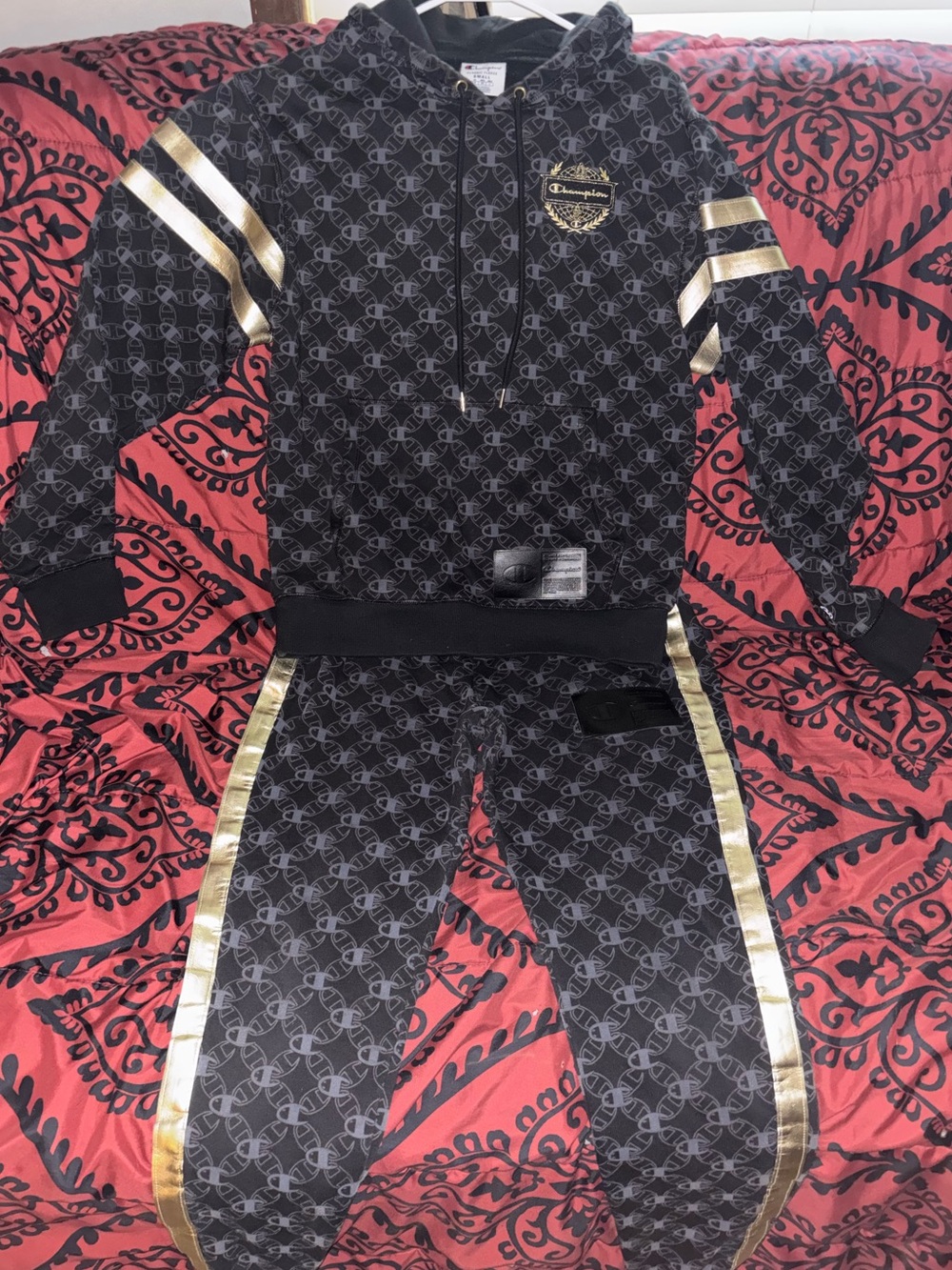 Champion hoodie and pants set, all over Black Logo-Print with Gold Trim.